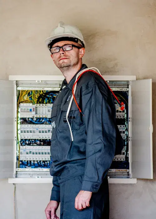 Electrician working on panel