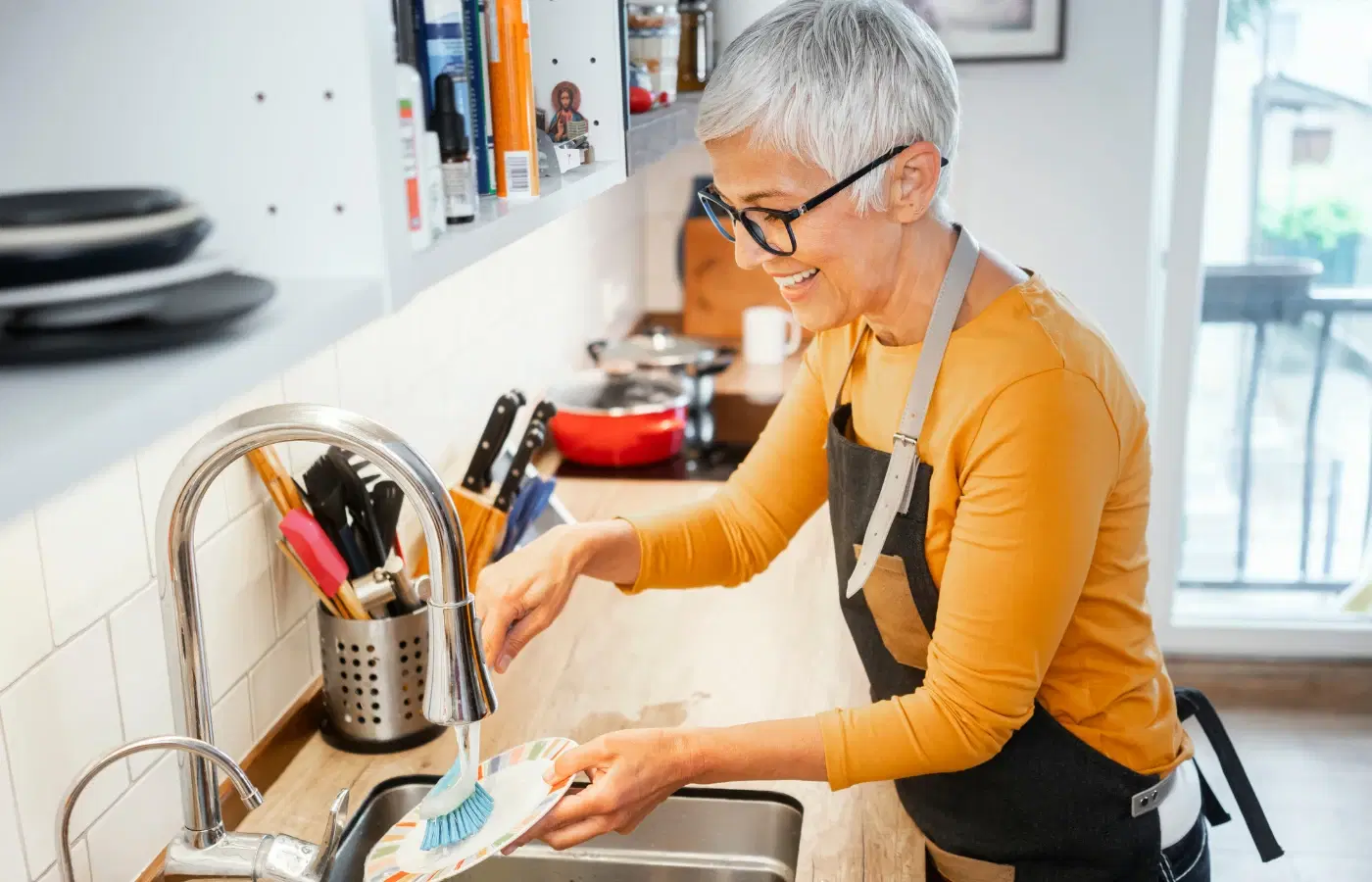 Woman washing dishes