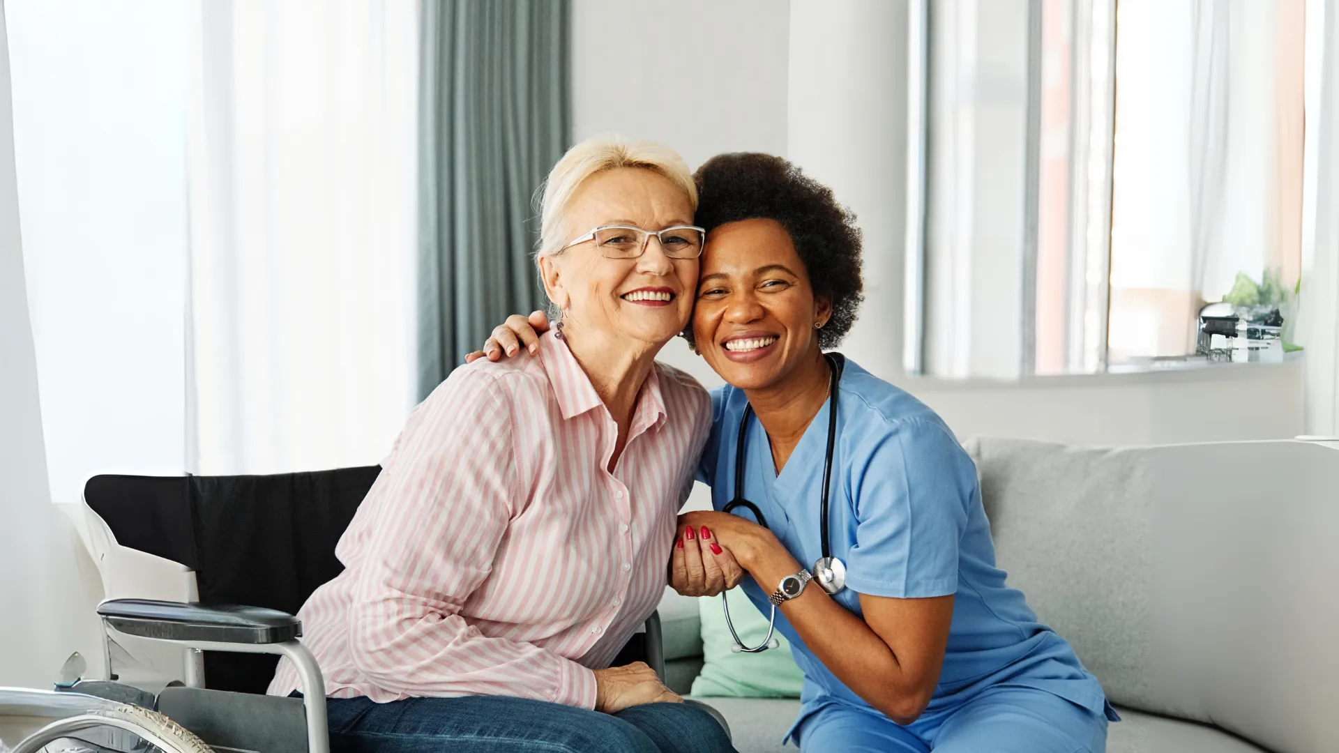Assisted living facility caretaker helping a senior resident.