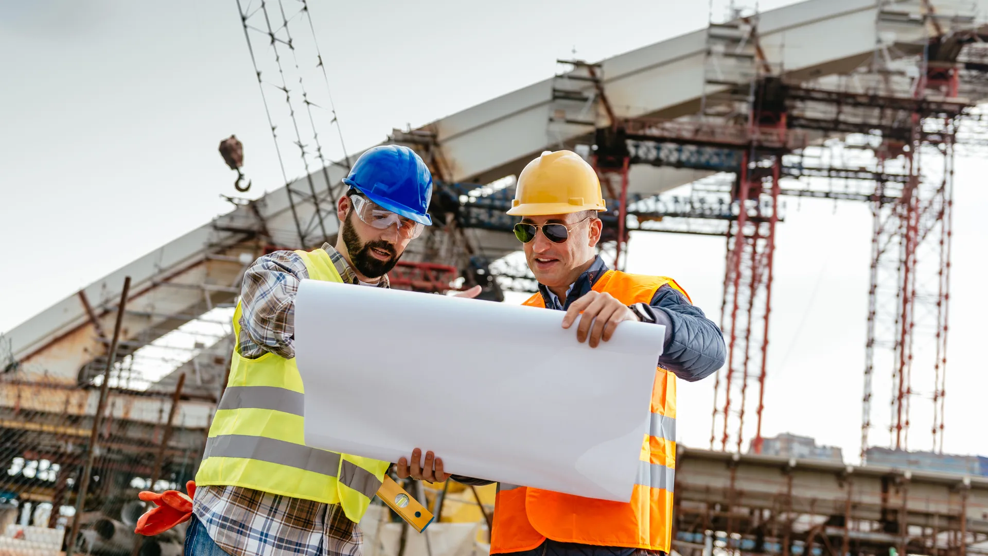 Engineers reviewing blueprints